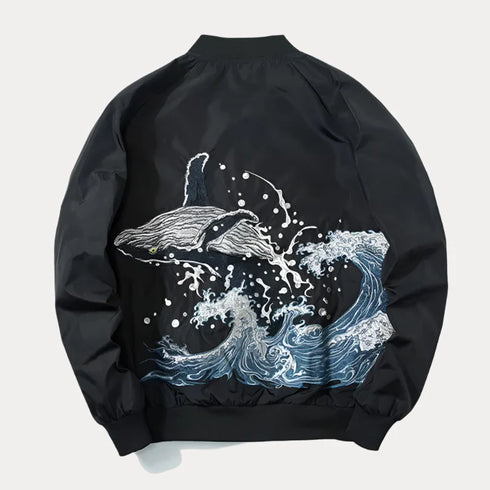 Black embroidered bomber baseball jacket with whale and wave design featuring zipper closure and rib sleeve cuffs.